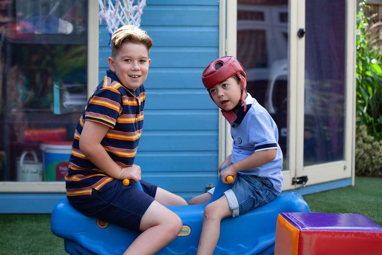 Jacob's story - Jacob on seesaw with brother Oliver